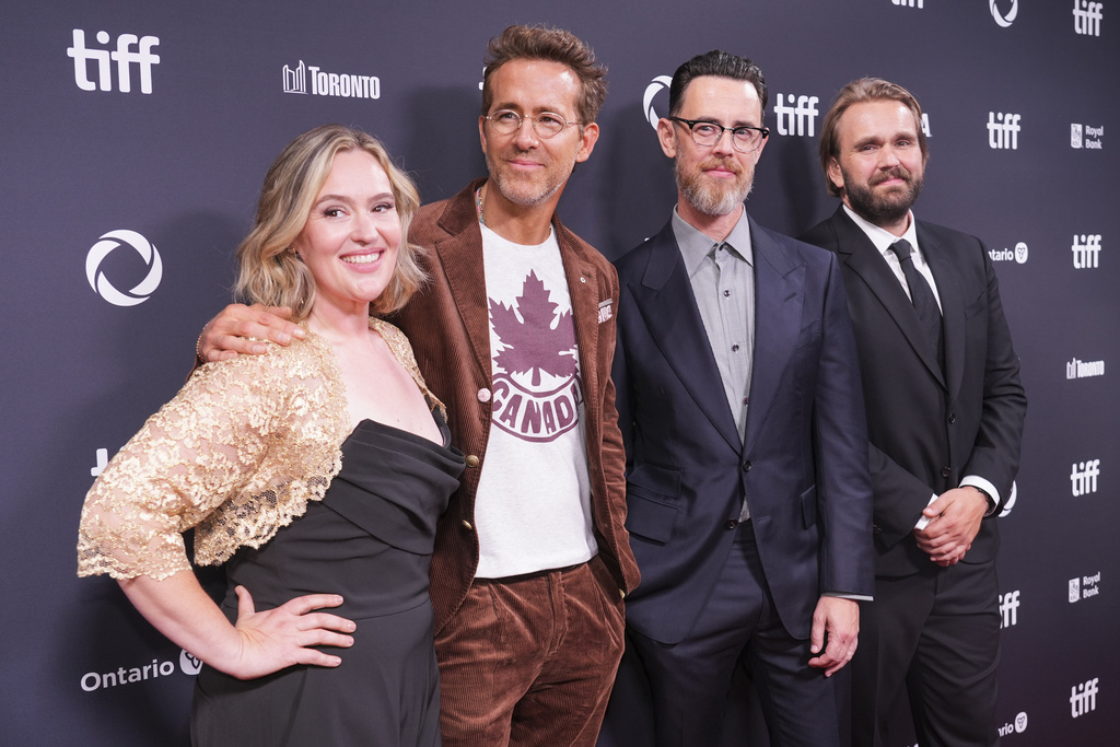 Jennifer Candy-Sullivan, from left, Ryan Reynolds, director Colin Hanks, and Chris Candy attend the premiere of "John Candy: I Like Me" during the Toronto International Film Festival on Thursday, Sept. 4, 2025, at Roy Thomson Hall in Toronto. (AP Photo/Chris Pizzello)