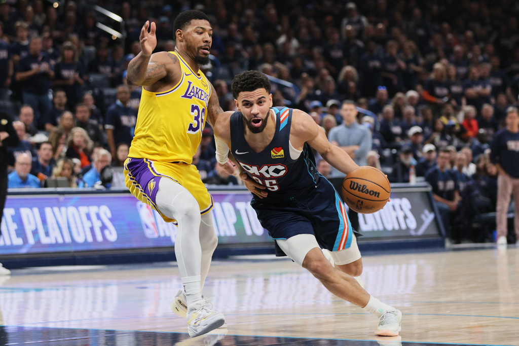 Oklahoma City Thunder guard Ajay Mitchell (25) drives to the basket against Los Angeles Lakers' Marcus Smart (36) in the second half of Game 2 in a second-round NBA basketball playoffs series Thursday, May 7, 2026, in Oklahoma City. (AP Photo/Nate Billings)