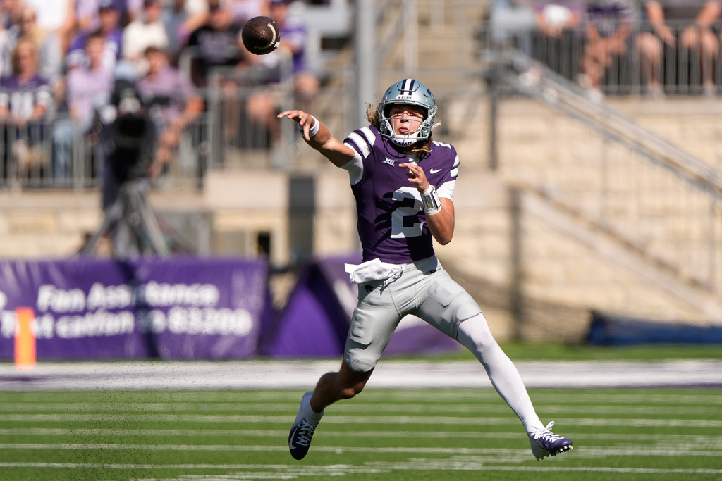Kansas State quarterback Avery Johnson passes during the first half of an NCAA college football game against Central Florida Saturday, Sept. 27, 2025, in Manhattan, Kan. (AP Photo/Charlie Riedel)