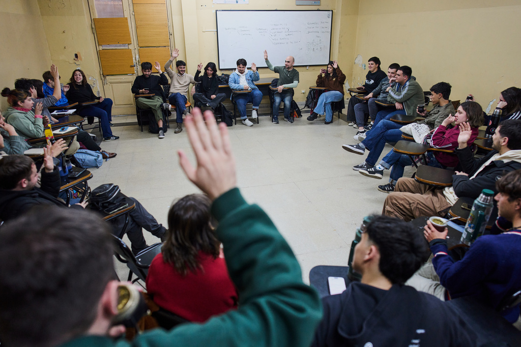 University students meet in a classroom to discuss debt in Buenos Aires, Argentina, Wednesday, Aug. 26, 2026. (AP Photo/Rodrigo Abd)