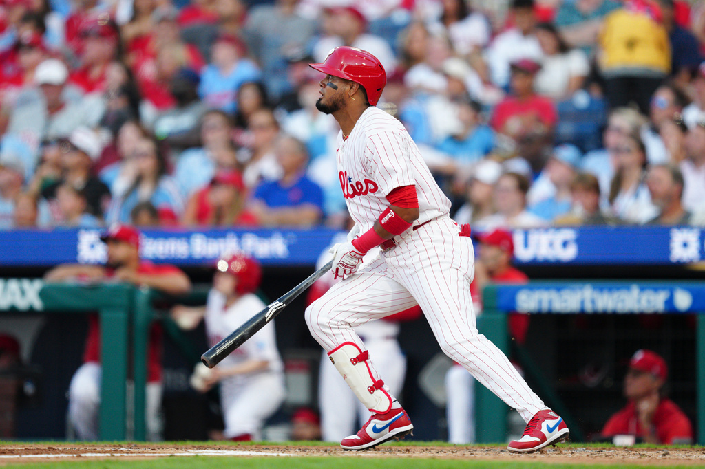 Philadelphia Phillies' Luis Arraez watches his two-run home run off Miami Marlins pitcher Sandy Alcantara during the third inning of a baseball game, Wednesday, Aug. 19, 2026, in Philadelphia. (AP Photo/Derik Hamilton)