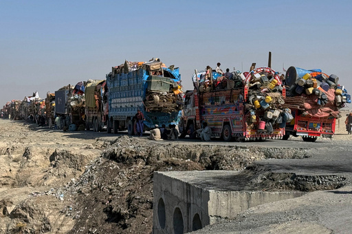 Afghan refugees sit beside trucks loaded with their belongings as they wait their turn to leave for their homeland through a border crossing point which partially opens following Oct.19 ceasefire, on the outskirts of Chaman, a border town on the Pakistan Afghan border, Wednesday, Oct. 29, 2025. (AP Photo/H. Achakzai) Afghan refugees sit beside trucks loaded with their belongings as they wait their turn to leave for their homeland through a border crossing point which partially opens following Oct.19 ceasefire, on the outskirts of Chaman, a border town on the Pakistan Afghan border, Wednesday, Oct. 29, 2025. (AP Photo/H. Achakzai)