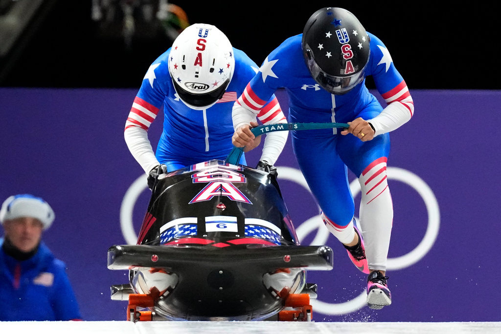 United States' Elana Meyers Taylor, right, and Jadin O'Brien start for a two women bobsled run at the 2026 Winter Olympics, in Cortina d'Ampezzo, Italy, Saturday, Feb. 21, 2026. (AP Photo/Aijaz Rahi)
