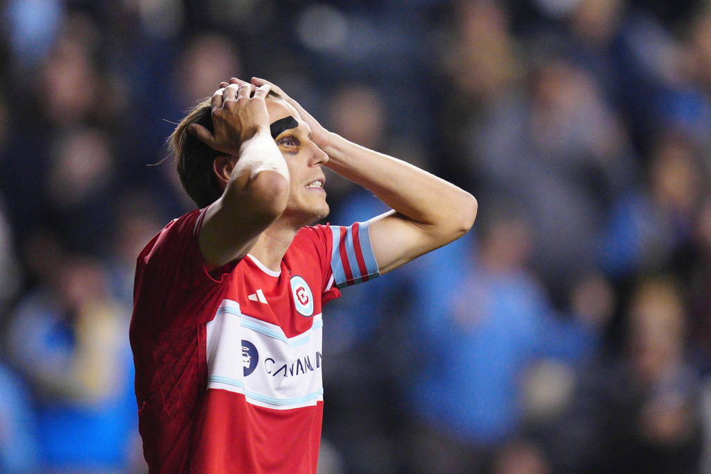 Chicago Fire's Jack Elliott reacts after missing a shot during a penalty shootout in Game 1 in the first round of MLS soccer's Eastern Conference playoffs against the Philadelphia Union, Sunday, Oct. 26, 2025, in Chester, Pa. (AP Photo/Derik Hamilton)