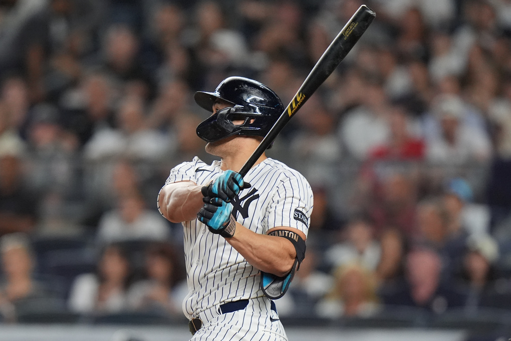 New York Yankees' Giancarlo Stanton hits a two-run home run during the first inning of a baseball game against the Baltimore Orioles Friday, Sept. 26, 2025, in New York. (AP Photo/Frank Franklin II)