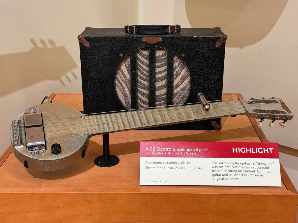 The Rickenbacher "Frying Pan" and its amplifier are displayed at the Musical Instrument Museum in Phoenix, Saturday, May 30, 2026. (AP Photo/Dario Lopez-Mills)