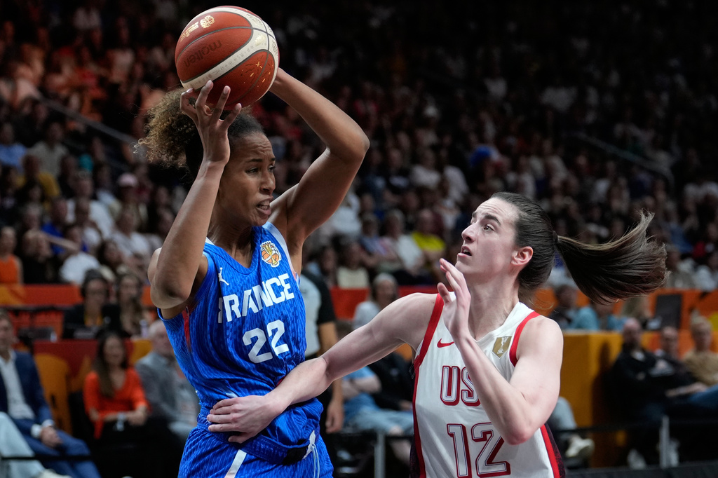 Caitlin Clark of the United States, guards France's Marieme Badiane during the Women's Basketball World Cup final match between the United States and France in Berlin, Sunday, Sept. 13, 2026. (AP Photo/Ebrahim Noroozi)