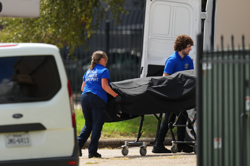 Police block off the street close to a U.S. Immigration and Customs Enforcement office after a reported shooting, in Dallas on Wednesday, Sept. 24, 2025. (AP Photo/Julio Cortez)