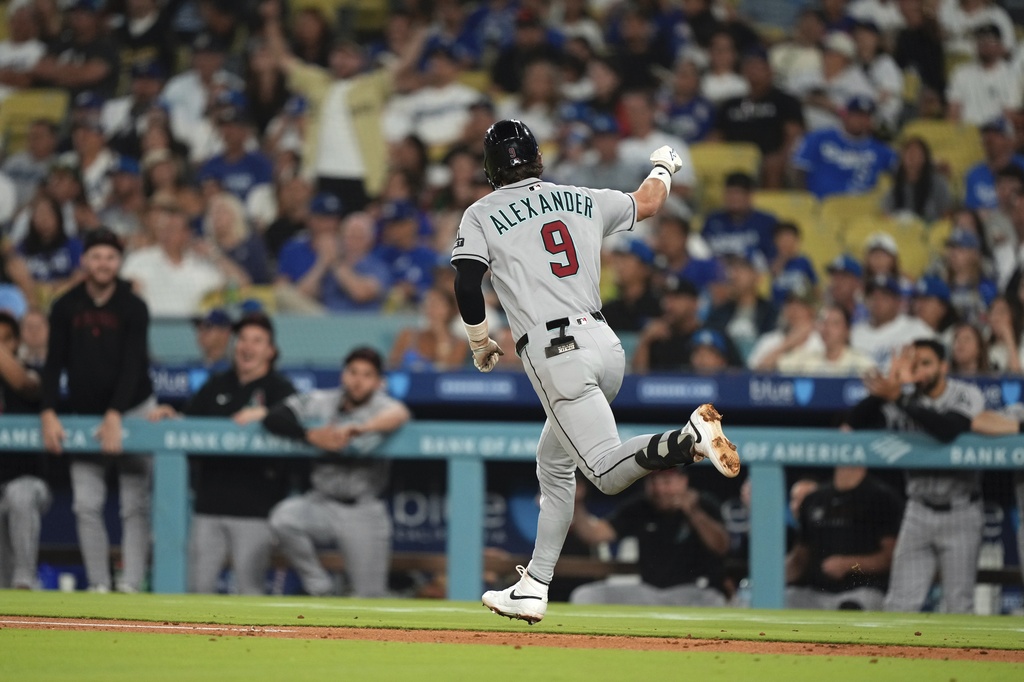 Arizona Diamondbacks' Blaze Alexander gestures toward his dugout after hitting a two-run home run during the fourth inning of a baseball game against the Los Angeles Dodgers, Friday, Aug. 29, 2025, in Los Angeles. (AP Photo/Mark J. Terrill)