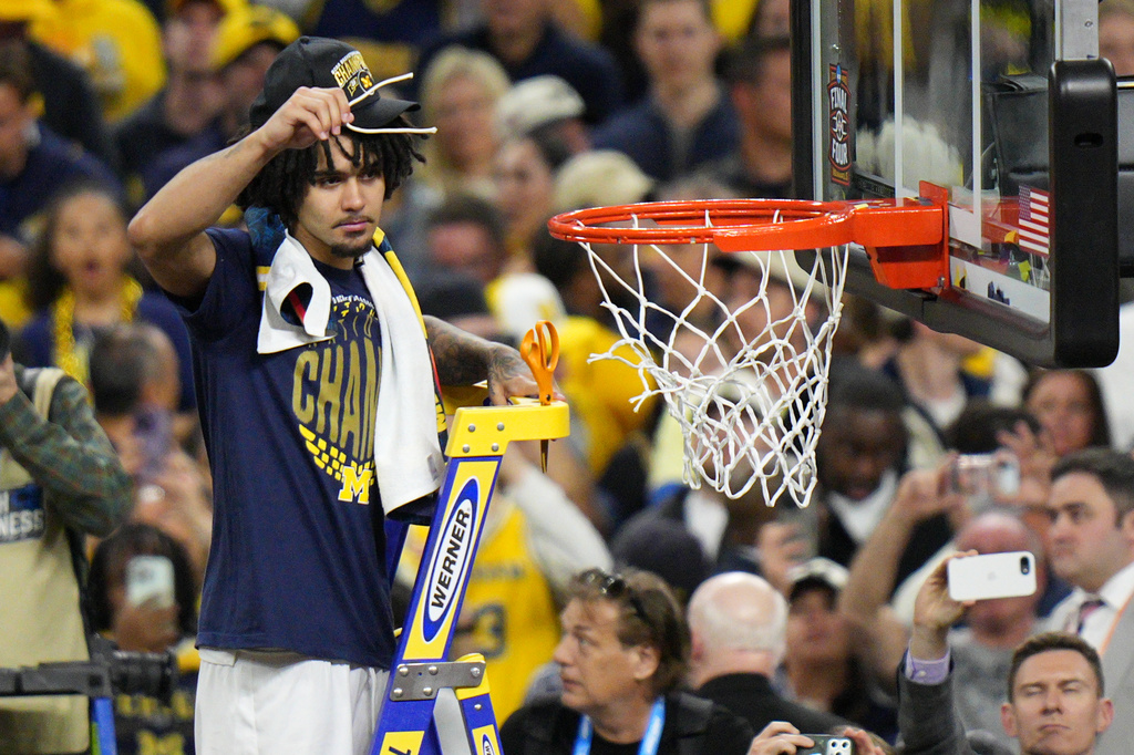 FILE - Michigan's Elliot Cadeau celebrates after defeating UConn in the NCAA college basketball tournament national championship game at the Final Four, April 6, 2026, in Indianapolis. (AP Photo/AJ Mast, File)