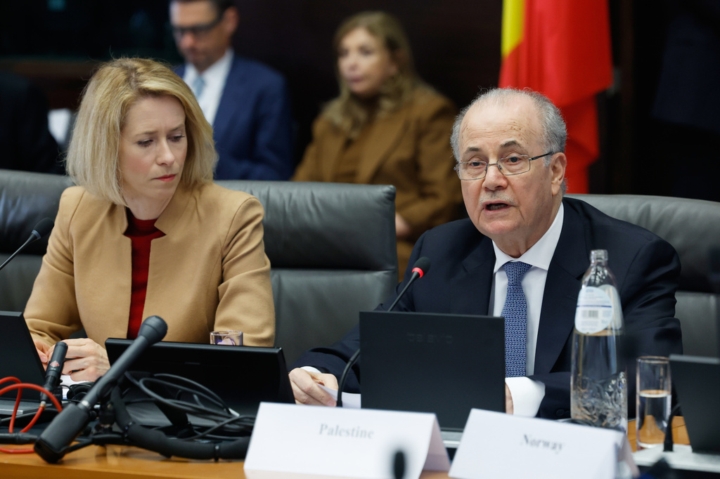 European Union foreign policy chief Kaja Kallas, left, listens as Palestinian Prime Minister Mohammad Mustafa speaks during a meeting of the Global Alliance for the Implementation of the Two-State Solution in Brussels, Monday, April 20, 2026. (AP Photo/Geert Vanden Wijngaert)