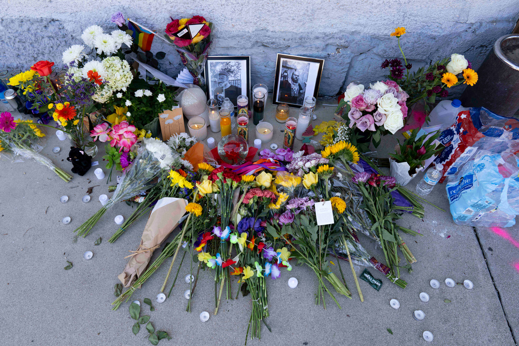 A growing memorial sits outside the Venture-N Bar in Tucson, Ariz., Tuesday, Sept. 1, 2026, for Vincent Siquieros and Cameron Capara, pictured, who were fatally shot in the parking lot of the gay bar shortly after midnight Monday. (AP Photo/Rebecca Noble)