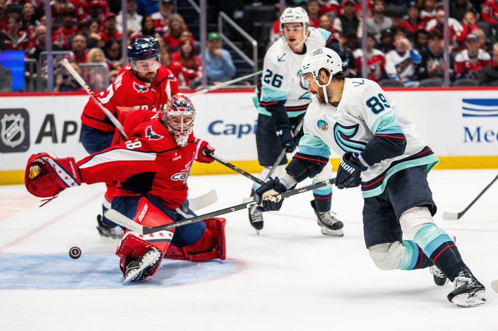 Seattle Kraken center Frederick Gaudreau (89) scores in action during the second period of an NHL hockey game against the Washington Capitals, Sunday, Oct. 11, 2026, in Washington. (AP Photo/Nathan Howard)
