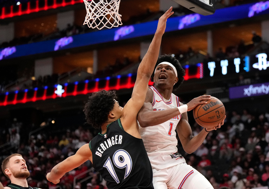 Houston Rockets guard Amen Thompson (1) goes up to the basket against Minnesota Timberwolves center Joan Beringer (19) during the first half of an NBA basketball game, Friday, April 10, 2026, in Houston. (AP Photo/ Karen Warren)