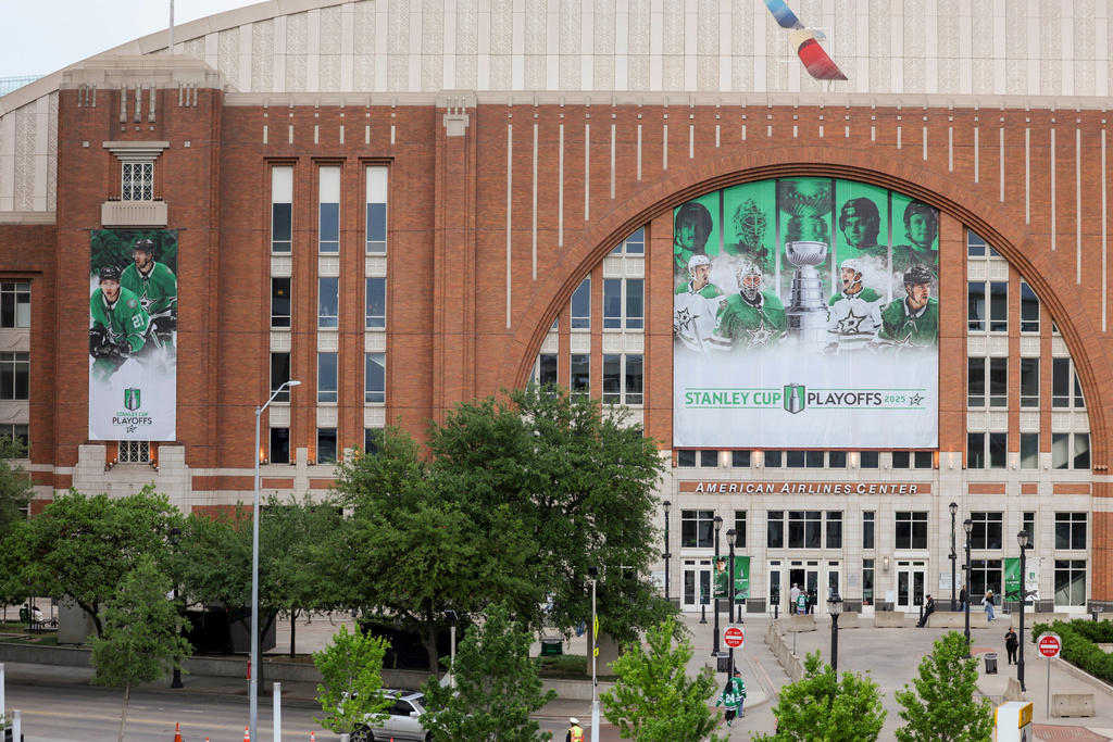 FILE - Dallas Stars Stanley Cup playoff banners are displayed outside of American Airlines Center before a first-round NHL hockey playoff against the Colorado Avalanche in Dallas, April 19, 2025. (AP Photo/Gareth Patterson, File)
