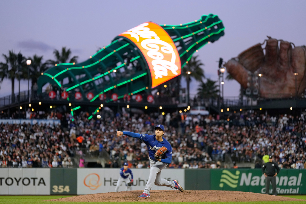 Los Angeles Dodgers pitcher Shohei Ohtani throws to a San Francisco Giants batter during the fifth inning of a baseball game Wednesday, April 22, 2026, in San Francisco. (AP Photo/Tony Avelar)