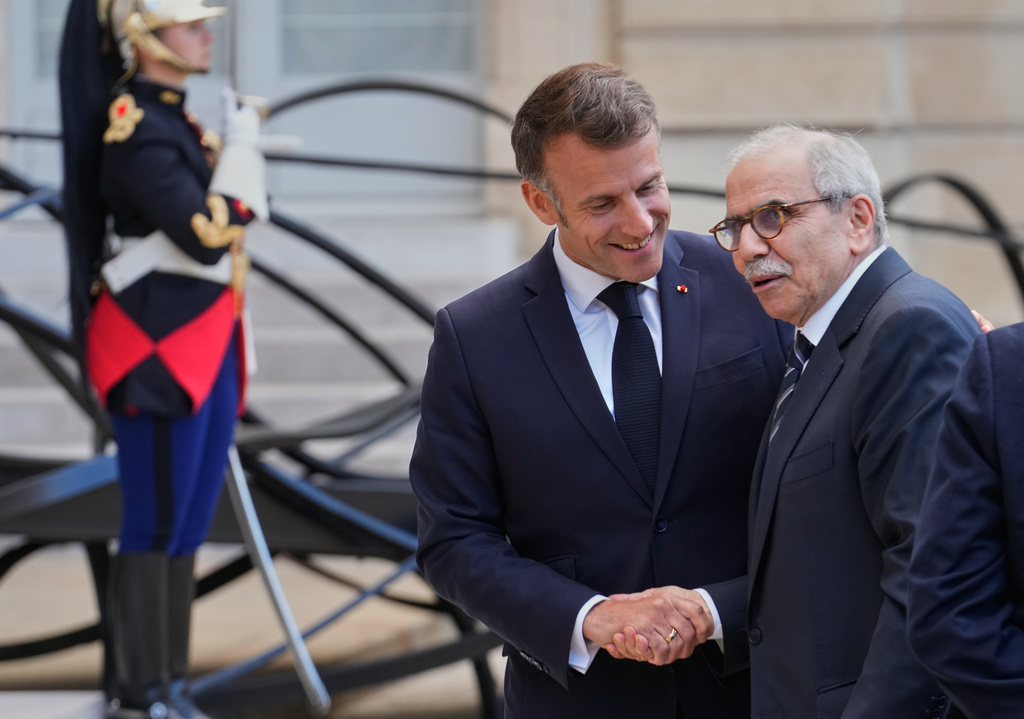 France's President Emmanuel Macron, left, welcomes Lebanon's Prime Minister Nawaf Salam for a meeting at the Elysee Palace in Paris, Tuesday, April 21, 2026. (AP PhotoMichel Euler)