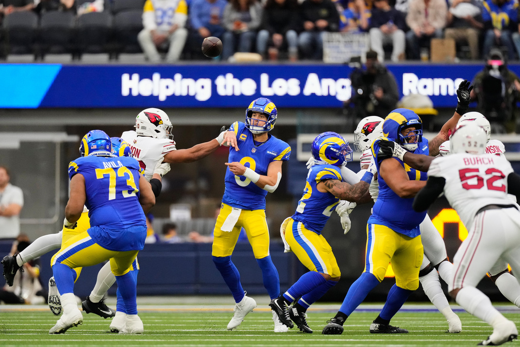 Los Angeles Rams quarterback Matthew Stafford (9) passes the ball during the first half of an NFL football game against the Arizona Cardinals, Sunday, Jan. 4, 2026, in Inglewood, Calif. (AP Photo/Mark J. Terrill)