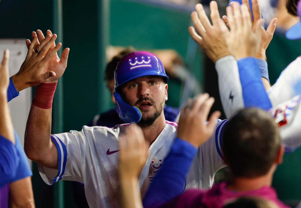 Kansas City Royals' Vinnie Pasquantino celebrates in the dugout after scoring off a Michael Massey single during the fourth inning of a baseball game against the Detroit Tigers in Kansas City, Mo., Friday, Aug. 21, 2026. (AP Photo/Colin E. Braley)