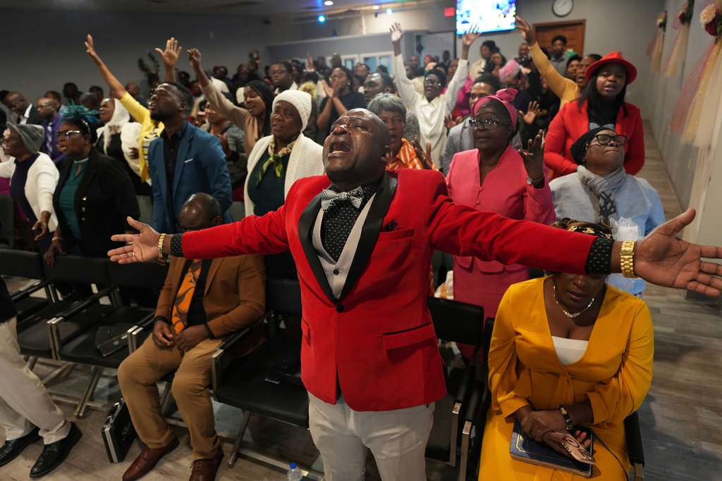 FILE - Jean-Michel Gisnel cries out while praying with other congregants at the First Haitian Evangelical Church of Springfield, Sunday, Jan. 26, 2025, in Springfield, Ohio. (AP Photo/Luis Andres Henao, File)