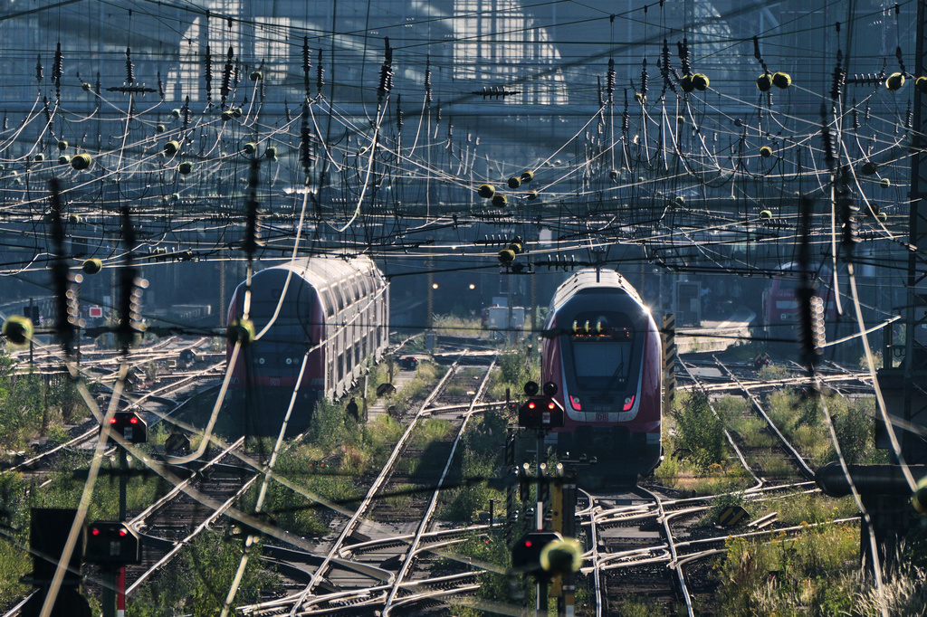 Trains are parked outside the central train station in Frankfurt, Germany, Wednesday, June 24, 2026, following the nationwide service disruption on the Deutsche Bahn network. (AP Photo/Michael Probst)