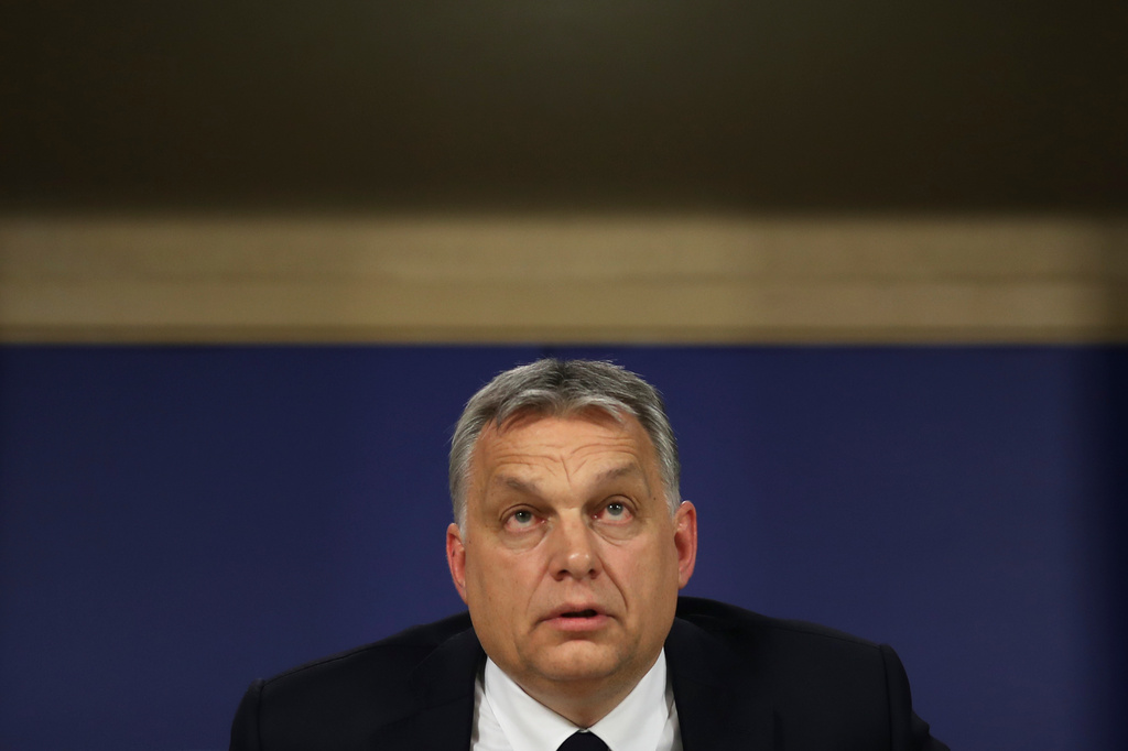 FILE -Hungarian Prime Minister Viktor Orban talks to journalists during a news conference following an European People's Party meeting at the European Parliament in Brussels, March 20, 2019. (AP Photo/Francisco Seco, File)