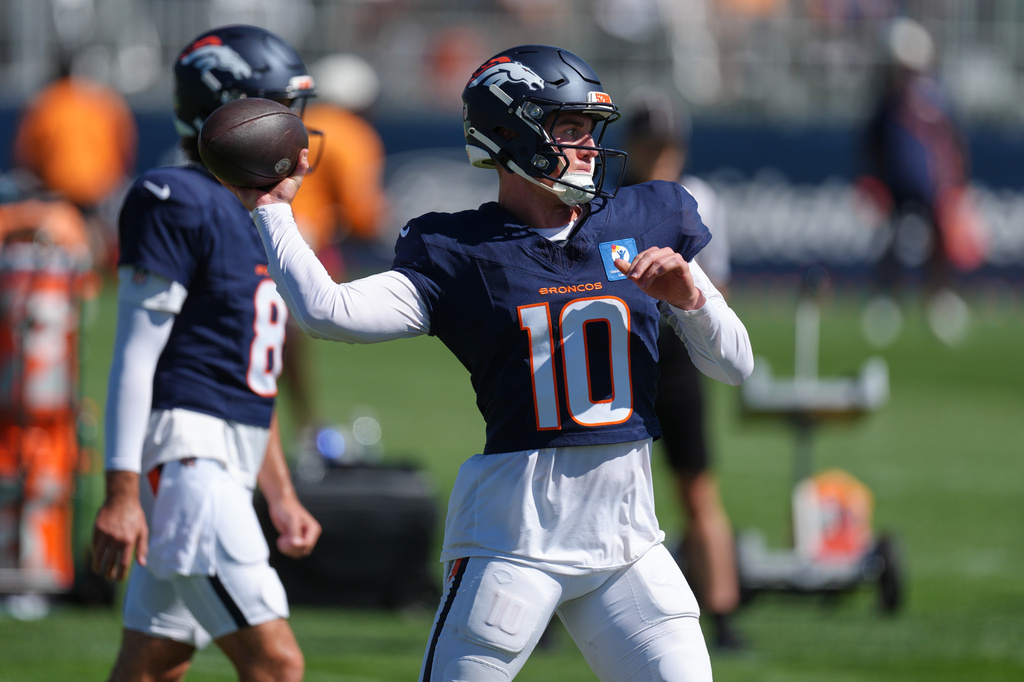 Denver Broncos quarterback Bo Nix takes part in drills during practice at the team's NFL football training camp Tuesday, Aug. 18, 2026, in Centennial, Colo. (AP Photo/David Zalubowski)