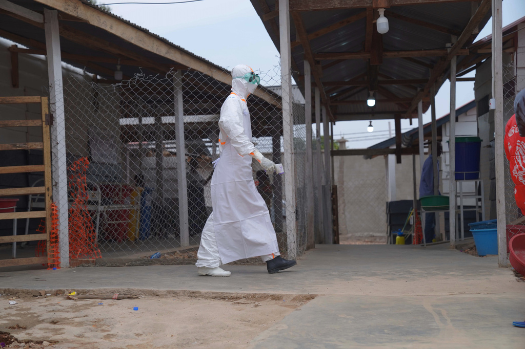 A health worker in protective gear walks at an Ebola treatment centre in Bunia, Congo, Monday, Aug. 10, 2026. (AP Photo/Dieudonne Dirole)