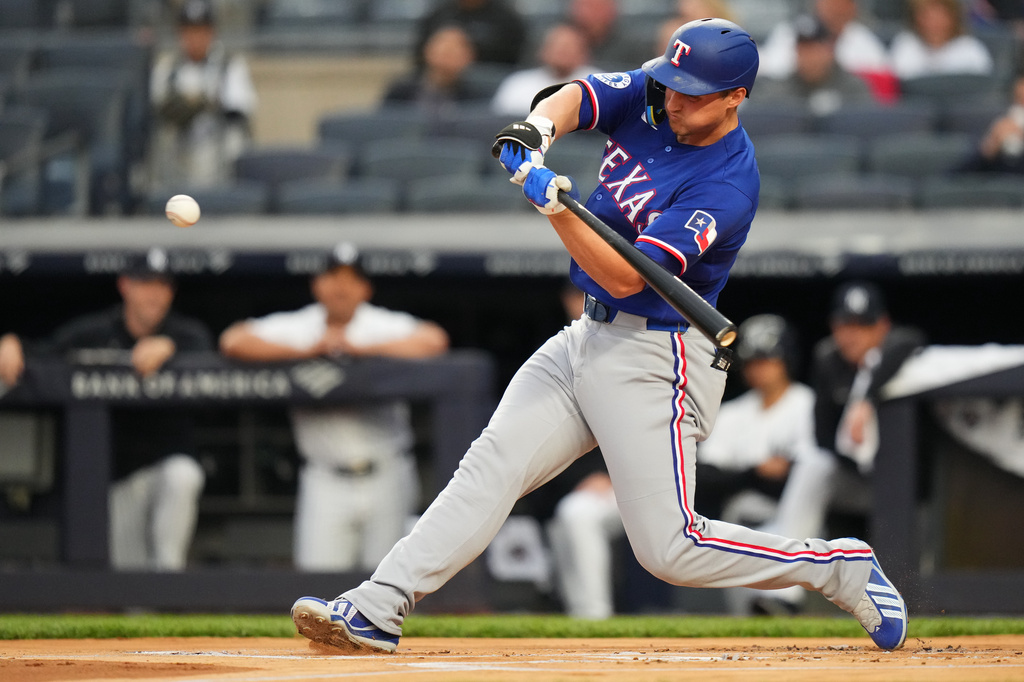 Texas Rangers' Corey Seager hits a home run during the first inning of a baseball game against the New York Yankees, Wednesday, May 6, 2026, in New York. (AP Photo/Frank Franklin II)
