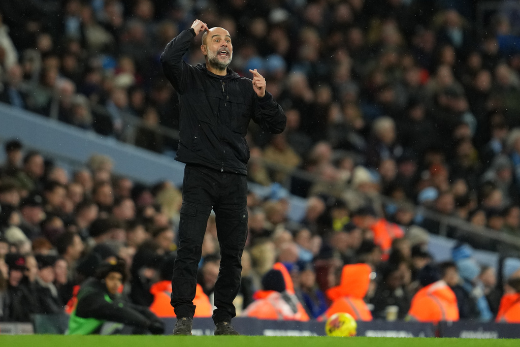 Manchester City's head coach Pep Guardiola reacts during the English Premier League soccer match between Manchetser City nad Newcastle in Manchester, England, Saturday, Feb. 21, 2026. (AP Photo/Jon Super)