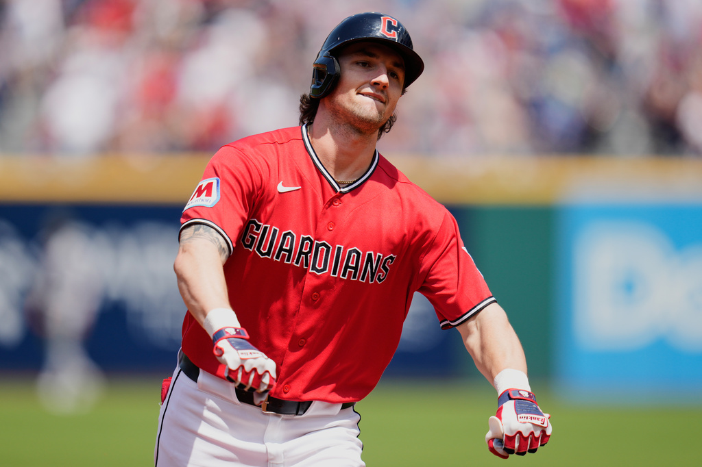 Cleveland Guardians' Chase DeLauter gestures as he runs the bases after hitting a home run in the first inning of a baseball game against the Cincinnati Reds in Cleveland, Sunday, May 17, 2026. (AP Photo/Sue Ogrocki)