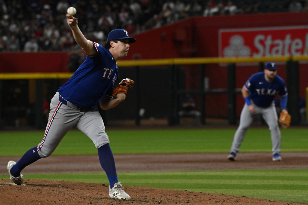 Texas Rangers' Pitcher Cal Quantrill pitches during the third inning of a baseball game against the Arizona Diamondbacks, Sunday, Sept. 13, 2026, in Phoenix. (AP Photo/Caitlin O'Hara)