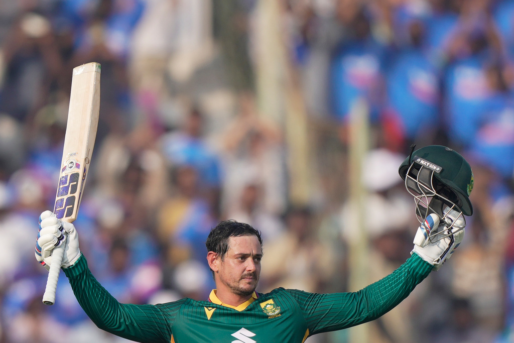 South Africa's Quinton de Kock celebrates his century during the third One Day International cricket match between India and South Africa in Visakhapatnam, India, Saturday, Dec. 6, 2025. (AP Photo/Mahesh Kumar A.)
