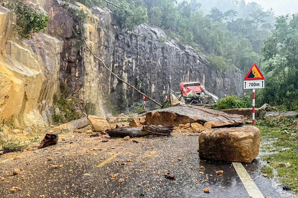 A passenger bus is crushed by a fatal landslide on Khanh Le pass in Khanh Hoa province, Vietnam, Monday, Nov. 17, 2025. (Minh Bang/VNExpress via AP)