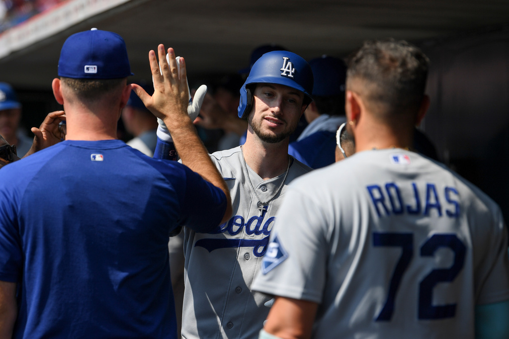Los Angeles Dodgers' Kyle Tucker celebrates in the dugout after hitting a two-run home run during the first inning of a baseball game against the Cincinnati Reds, Thursday, Sept. 17, 2026 in Cincinnati. (AP Photo/Tanner Pearson)