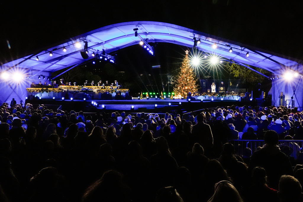 President Donald Trump, accompanied by first lady Melania Trump, speaks following the lighting of the National Christmas Tree on the Ellipse, Thursday, Dec. 4, 2025, near the White House in Washington. (AP Photo/Julia Demaree Nikhinson)