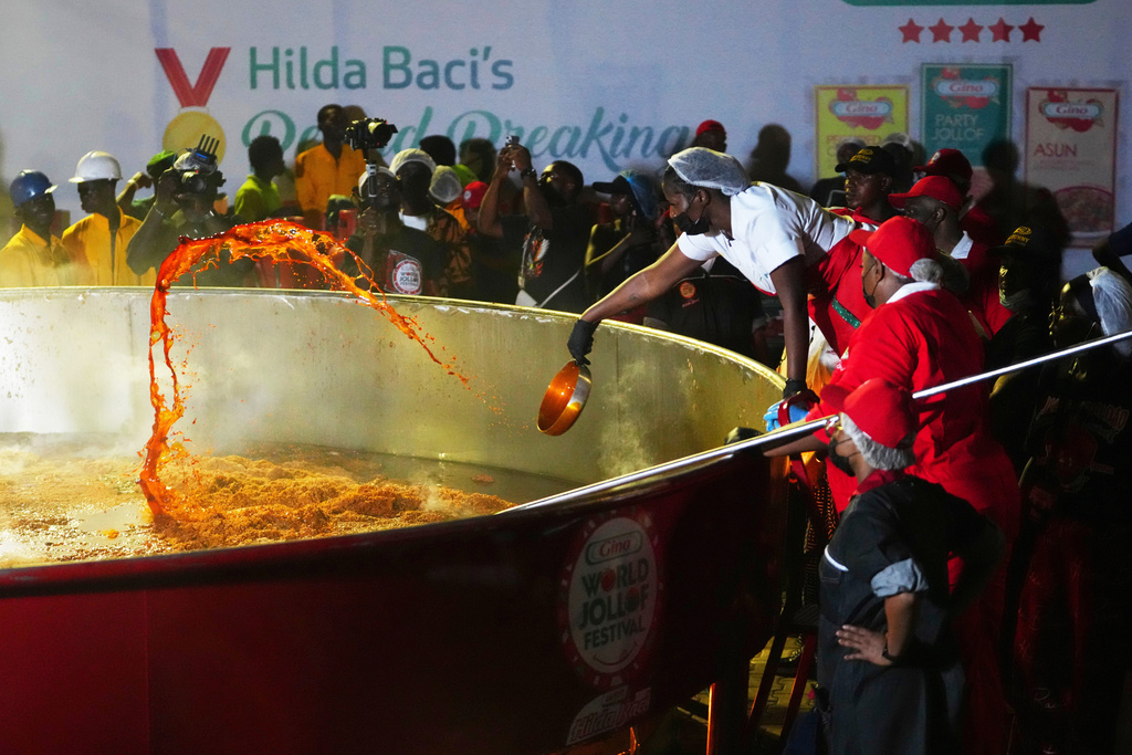 Chef Hilda Baci attempts to cook the world's largest pot of Jollof Rice in Lagos, Nigeria, on Friday, Sept 12, 2025. (AP Photo/Sunday Alamba)
