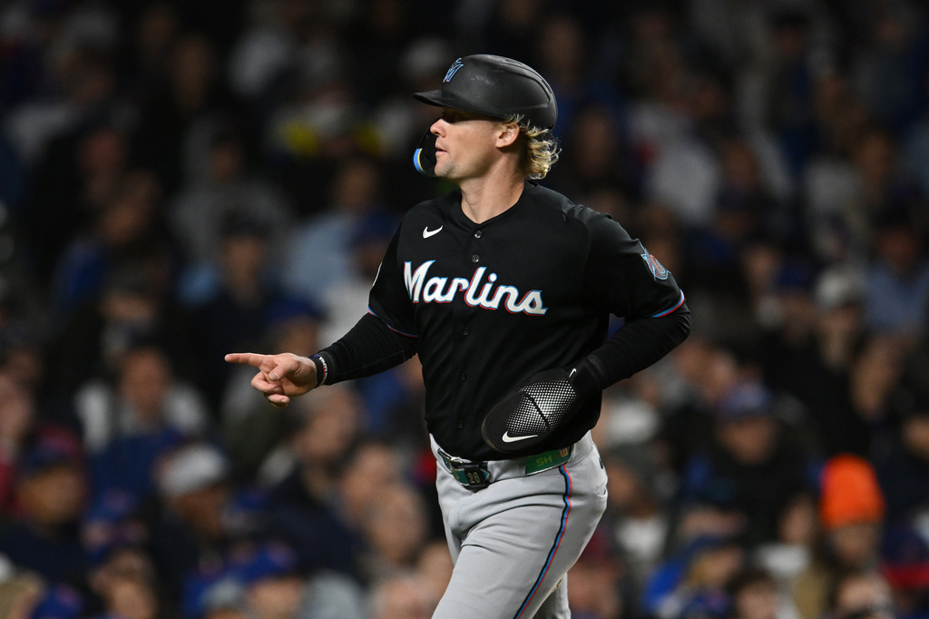 Miami Marlins' Kyle Stowers celebrates after scoring on a Agustin Ramirez single during the fourth inning of a baseball game against the Chicago Cubs Tuesday, Sept. 22, 2026, in Chicago. (AP Photo/Paul Beaty)