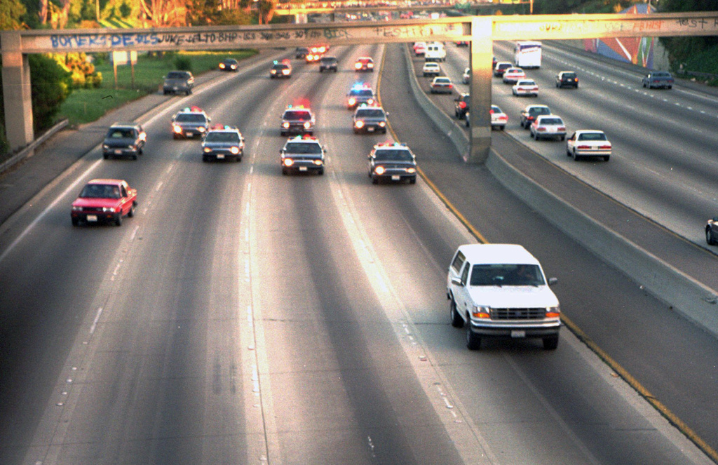 FILE - A white Ford Bronco, driven by Al Cowlings carrying O.J. Simpson, is trailed by Los Angeles police cars as it travels on a Southern California freeway in Los Angeles on June 17, 1994. (AP Photo/Joseph Villarin, File)
