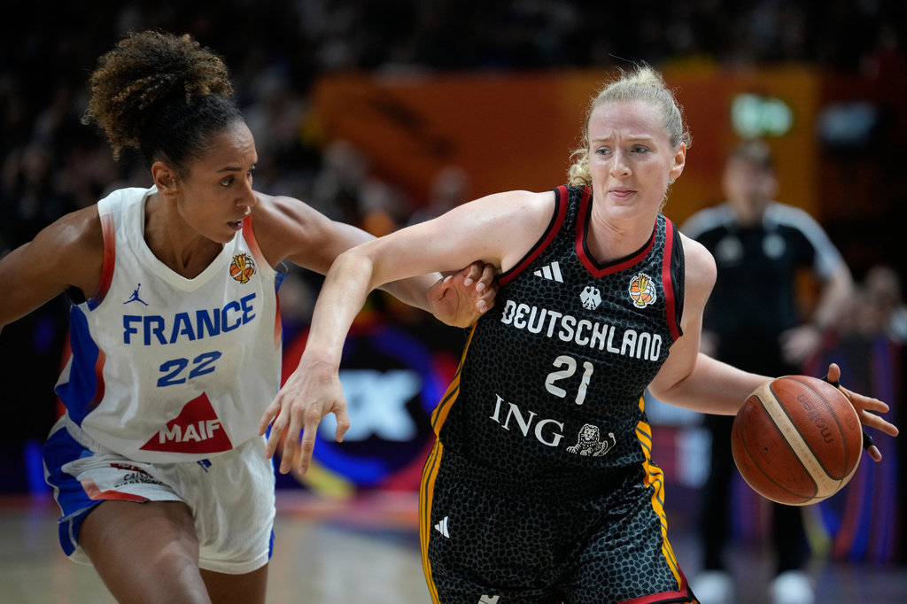 France's Marieme Badiane guards Germany's Marie Guelich during the Women's Basketball World Cup semifinal match between France and Germany in Berlin, Saturday, Sept. 12, 2026. (AP Photo/Ebrahim Noroozi)