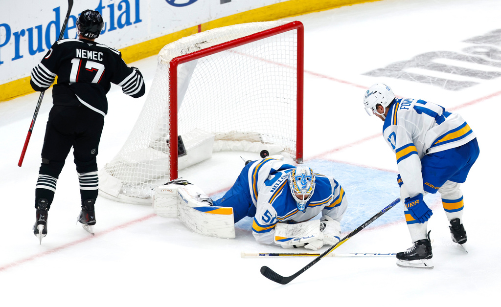 St. Louis Blues goaltender Jordan Binnington (50) and defenseman Cam Fowler (17) react after the game winning goal by New Jersey Devils defenseman Simon Nemec (17) during overtime of an NHL hockey game, Wednesday, Nov. 26, 2025, in Newark, N.J. (AP Photo/Noah K. Murray)