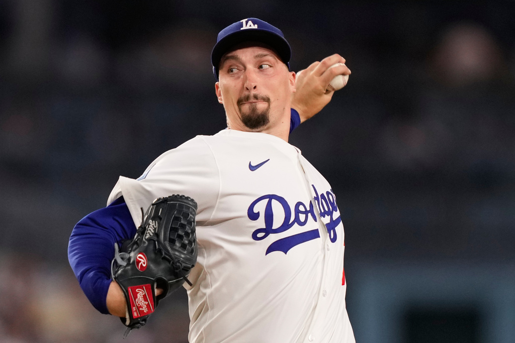Los Angeles Dodgers pitcher Blake Snell throws to a Cincinnati Reds batter during the third inning in Game 1 of the National League Wild Card baseball playoff series Tuesday, Sept. 30, 2025, in Los Angeles. (AP Photo/Mark J. Terrill)