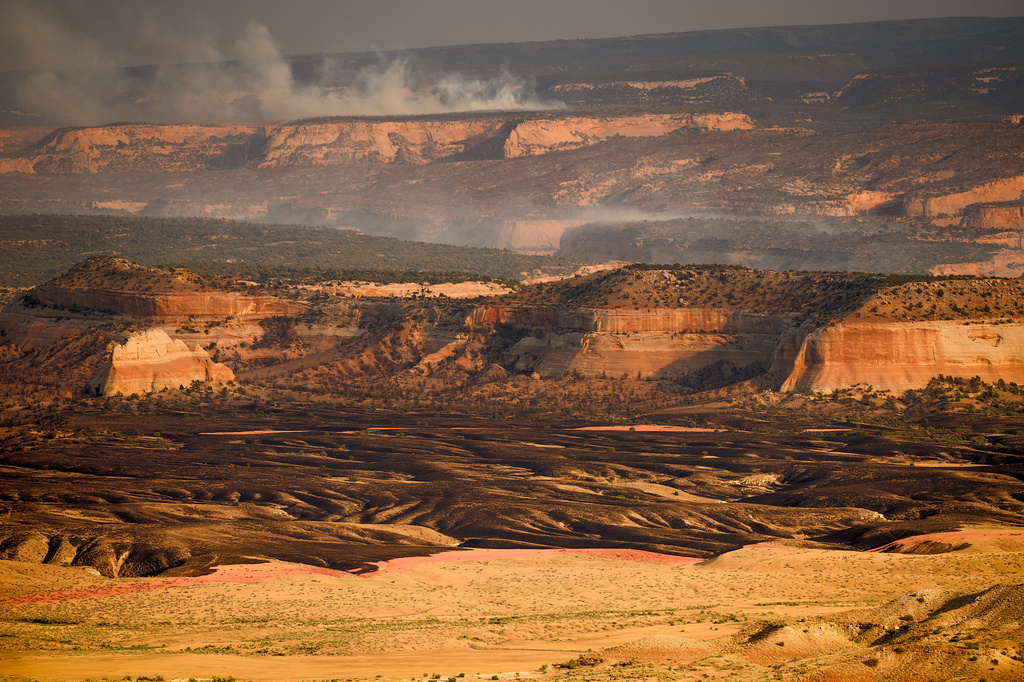 Smoke rises from the Snyder Fire burning near Thompson Springs, Utah, on Sunday, June 28, 2026. (AP Photo/Noah Berger)