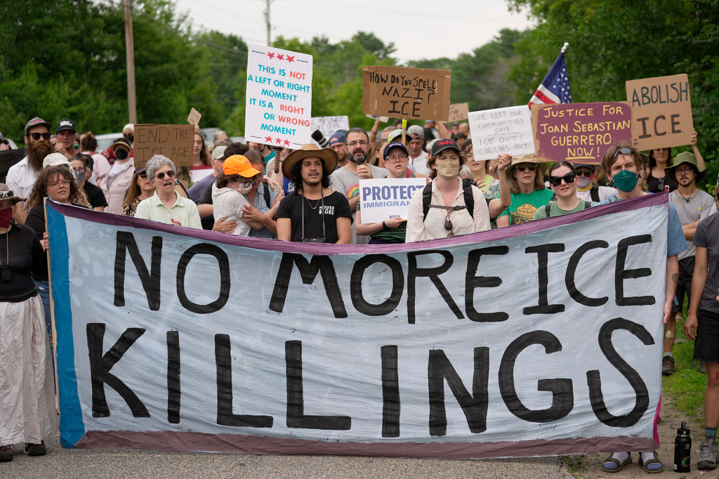 Protesters gather near a U.S. Immigration and Customs Enforcement facility Scarborough, Maine, one day after the shooting of Johan Sebastián Durán Guerrero, Tuesday, July 14, 2026. (AP Photo/Robert F. Bukaty) CORRECTION: Corrects ID to Johan Sebastián Durán Guerrero NOT Joan Sebastian Guerrero
