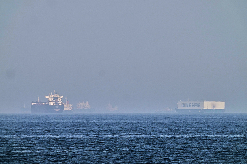 A tanker, left, and a car carrier are anchored at sea in the Gulf of Oman near the Strait of Hormuz, as seen from the coast near Khor Fakkan, United Arab Emirates, Friday, May 1, 2026.(AP Photo/Fatima Shbair)