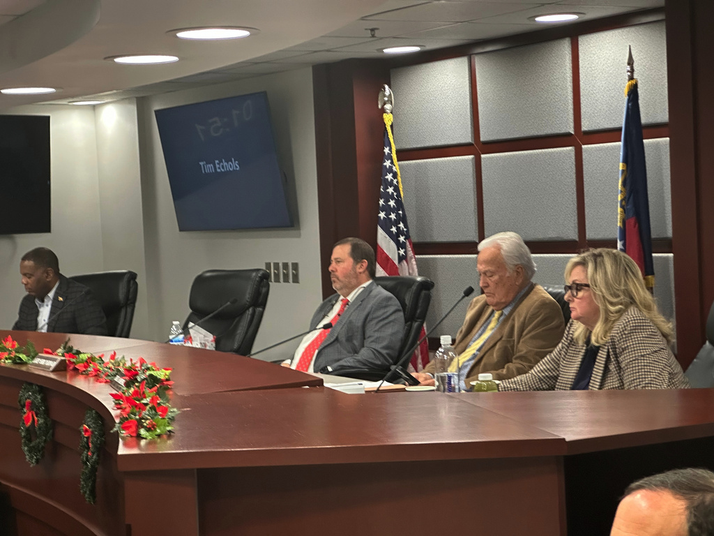 Members of the Georgia Public Service Commission listen to testimony on Friday, Dec. 19, 2025 in Atlanta. (AP Photo/Jeff Amy)