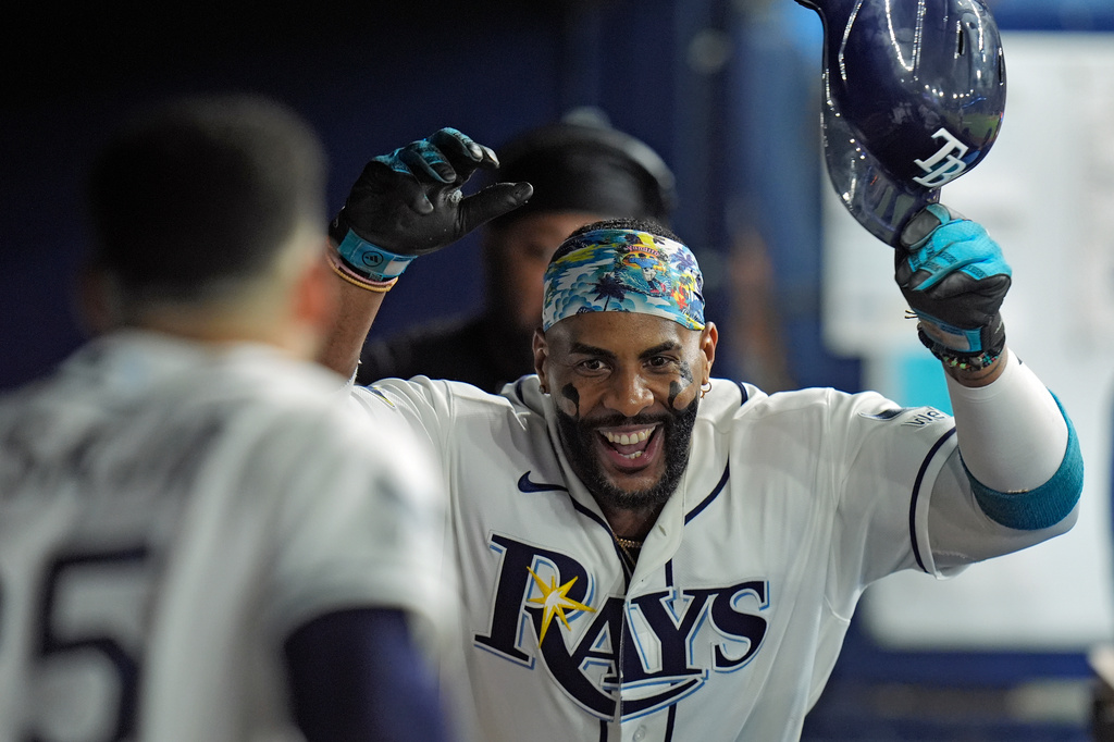 Tampa Bay Rays' Yandy Díaz celebrates in the dugout after his solo home run off New York Mets pitcher Sean Manaea during the sixth inning of a baseball game Tuesday, Sept. 1, 2026, in St. Petersburg, Fla. (AP Photo/Chris O'Meara)