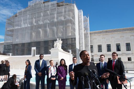 Janai Nelson, front center, president of the NAACP Legal Defense Fund, who was arguing on behalf of a group of Black voters speaks with the news media after departing the court, Wednesday, Oct. 15, 2025, in Washington. (AP Photo/Cliff Owen) Janai Nelson, front center, president of the NAACP Legal Defense Fund, who was arguing on behalf of a group of Black voters speaks with the news media after departing the court, Wednesday, Oct. 15, 2025, in Washington. (AP Photo/Cliff Owen)