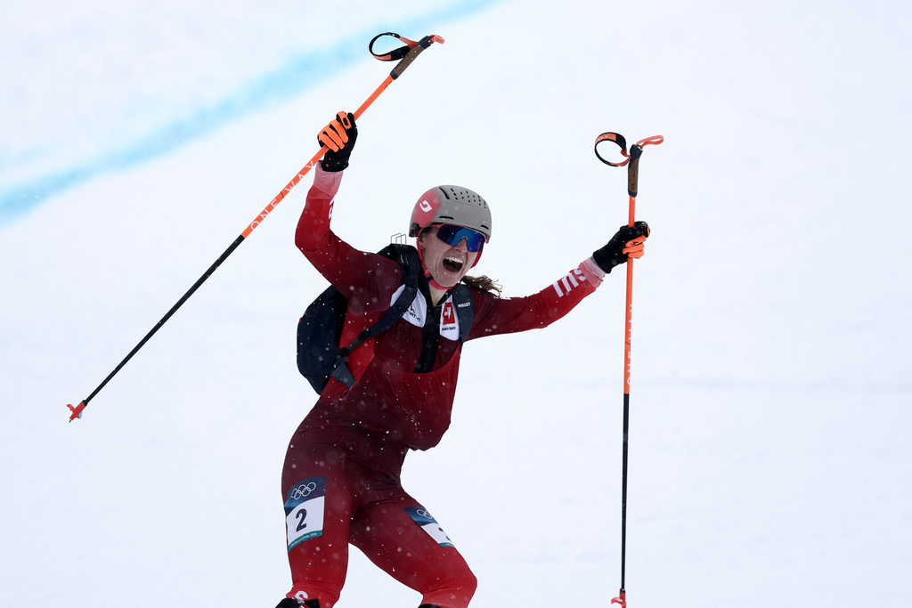 Switzerland's Marianne Fatton celebrates winning a ski mountaineering women's final at the 2026 Winter Olympics, in Bormio, Italy, Thursday, Feb. 19, 2026. (AP Photo/Gabriele Facciotti)