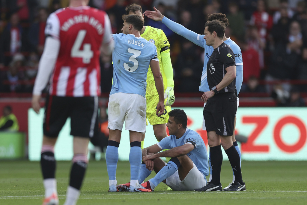 Manchester City's Rodri on the floor, before being taken off as injured, during the English Premier League soccer match between Brentford and Manchester City at the Gtech Community Stadium, Brentford, England, Sunday Oct. 5, 2025. (Steven Paston/PA via AP)